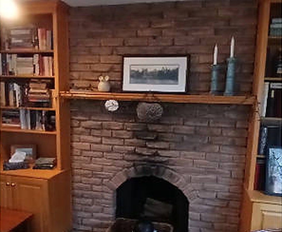 Fireplace and built-in refinishing by Acclivity Contracting Group